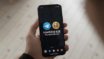 һ���������ֻ�����Ļ����ʾTelegram��TON�ҵ�ͼ�꣬ͼ�ﻹҪע����TON�ҵ�ȫ����The Open Network��
